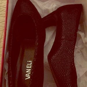 Black Vaneli heels.